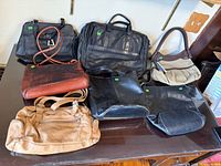 Group shot showing all seven handbags on table