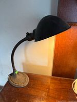 Lamp side view lit showing shade and gooseneck