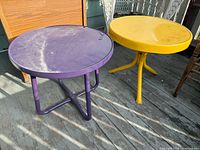 Purple and yellow metal round tables on deck