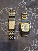 Both watches side by side showing overall design and bracelets