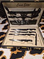 Open Casa Elite briefcase showing full 6-piece set in molded tray and lid holder