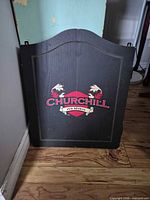 Closed black Churchill dartboard cabinet