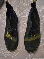 top view of both boots showing color accents and wear