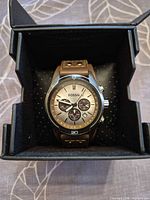 Watch in presentation box, dial and case visible