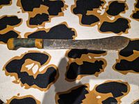 Full view of machete on patterned surface
