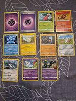 All 12 Pokémon cards laid out in three rows