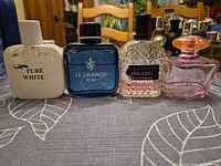 Front view of all four perfume bottles side by side