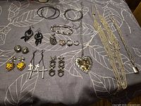 Entire lot laid out on fabric showing all pieces