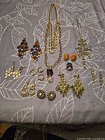 Full lot layout showing necklace, earrings and rings