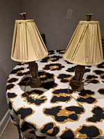 Pair of lamps on table showing overall appearance, shades and bases