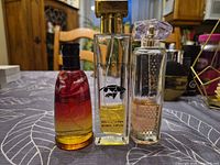 Three perfume bottles front view