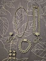 Full set layout showing both necklaces, bracelet, earrings and pendant