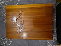 top view of wooden box showing carved title