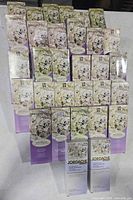 Front view showing 31 sealed perfume boxes stacked