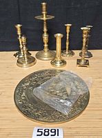 Front view showing sundial, gnomon in plastic, and six candlesticks