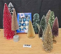 Group shot showing all bottle brush trees and boxed glass ornaments