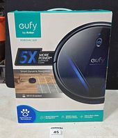 Front of retail box showing Eufy RoboVac V-20 features