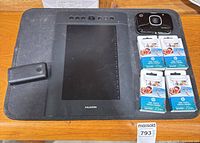 Huion tablet, HP Sprocket 2-in-1, Anker charger, four HP Zink paper packs overview