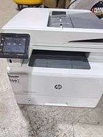 Front and side view of HP LaserJet multifunction printer
