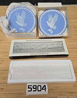 Overall view showing two boxed blue jasperware tiles and boxed Parthenon Frieze relief