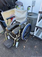 Full view of Raz Design commode shower chair showing frame, seat, armrests, footrests and wheels