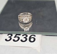 Front view of sterling silver CZ ring showing stone arrangement and metal finish