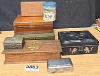 Group shot of all eight boxes and tin