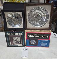 Both strobe lights and their boxes