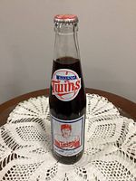 Front view of unopened 10 oz Coca-Cola bottle with Minnesota Twins Rod Carew label