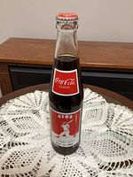 Front view of sealed Coca-Cola Pete Rose 4192 commemorative bottle