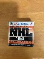 Front of sealed EA Sports NHL ’94 game card box showing title and sealed wrapping