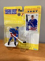 Front view of sealed blister pack showing figure and card