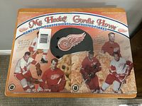 Front view of two shrink-wrapped Gordie Howe cereal boxes showing flavors and player images