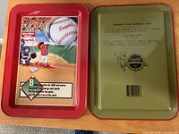 Front and back views of the two Campbell Kids Baseball metal trays
