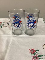 Both glasses displaying old Blue Jays logo