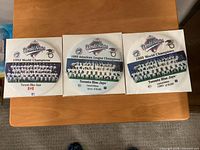 Three Toronto Blue Jays championship pinback buttons in packaging