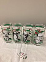 Front view of four glasses showing player portraits and team graphics