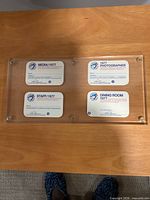 Front view showing four passes in acrylic case
