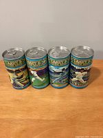 Front view of four Casey's Lager Baseball series cans showing player illustrations