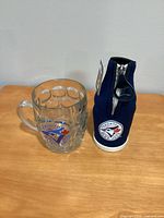 Mug and bottle holder side by side displaying design details