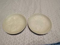 Both Rosenthal Magic Flute relief plates front view