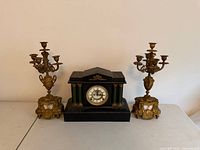Front view of clock and both candelabras