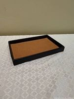 Angled top view of rectangular leather valet tray