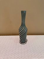 Full front view of vase showing overall shape and swirl pattern