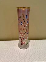 full view of tall frosted glass vase with floral design and gold rim