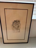 Full view of framed print showing matting and frame