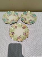 Top view of three matching M.Z. Austria plates