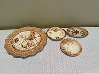 Top view of four plates showing designs and sizes