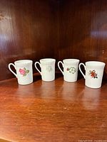 Four Royal London bone china tea cups lined up