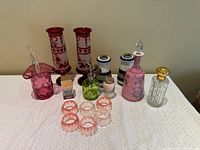 Full lot view on table showing all glass items